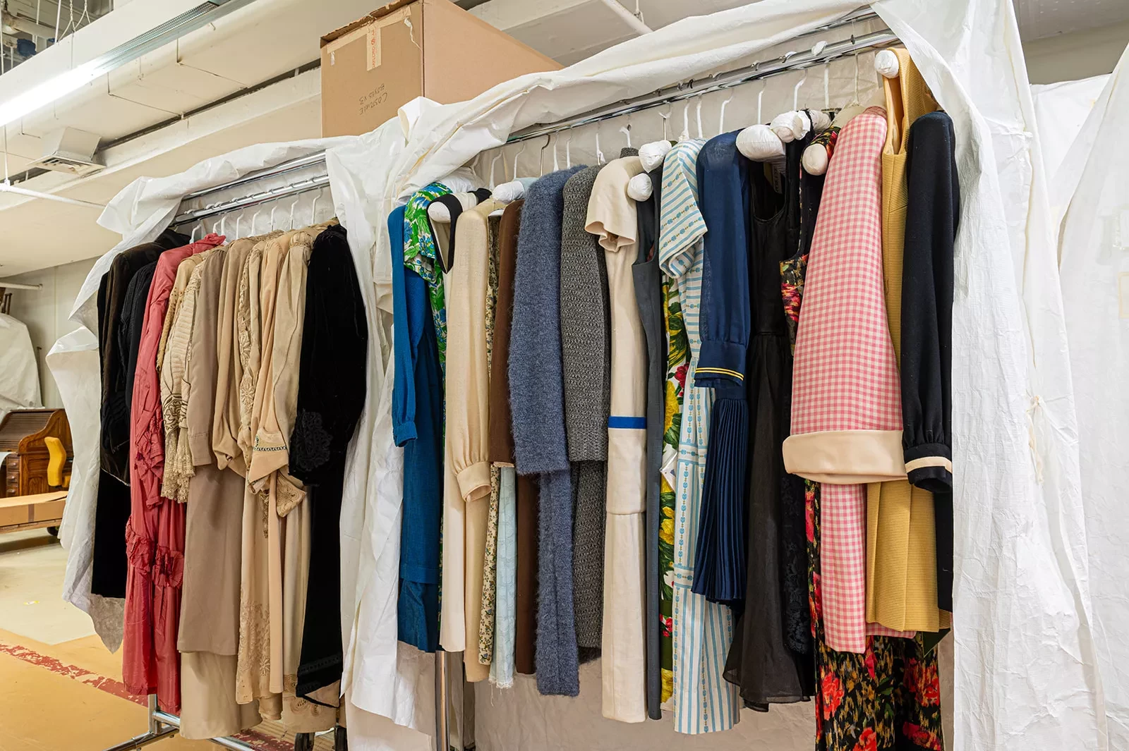 A rack of vintage dresses